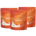 Three stand-up pouches of RYze Superfood Creamer in Pumpkin Spice flavor, arranged in a fan shape on a plain white background.