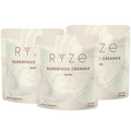 Three stand-up pouches of RYZE Superfood Creamer in Vanilla flavor, arranged in a fan shape on a plain white background.