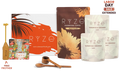 Ryze mushroom coffee gift set featuring a large orange and white box, a brown pouch labeled 'RYZE MUSHROOM COFFEE', three white pouches of 'RYZE SUPERFOOD CREAMER' in vanilla, coconut, and chocolate flavors, two wooden measuring spoons, a wooden spoon handle, and a 'FREE FROTHER' gift prop, with a 'LABOR DAY SALE EXTENDED' badge.