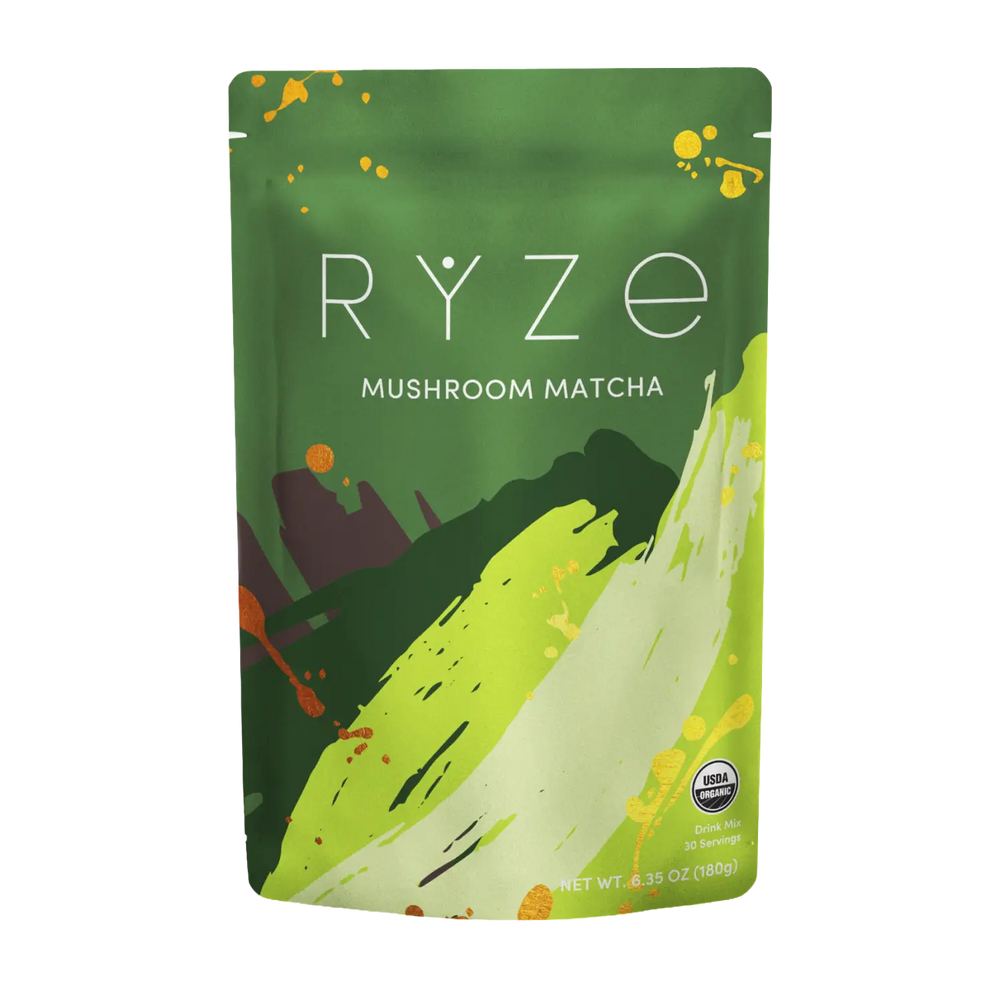 A stand-up pouch of RYZE Mushroom Matcha on a plain white background. The packaging is primarily green with abstract brushstroke graphics in yellow-green, white, and dark green, along with small orange and yellow paint splatters.